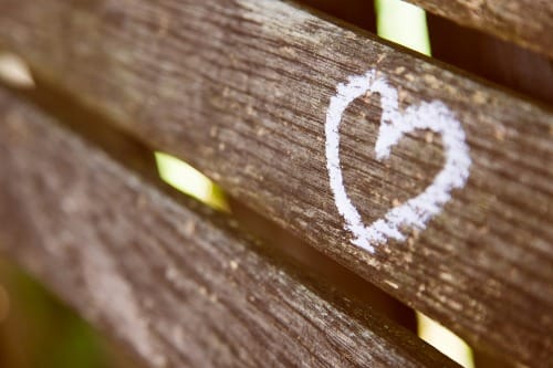 brown wooden panel with white heart