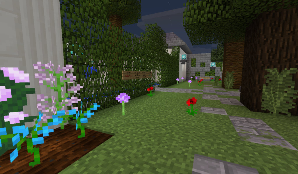 A Minecraft garden room with pink flowers and a grassy path.